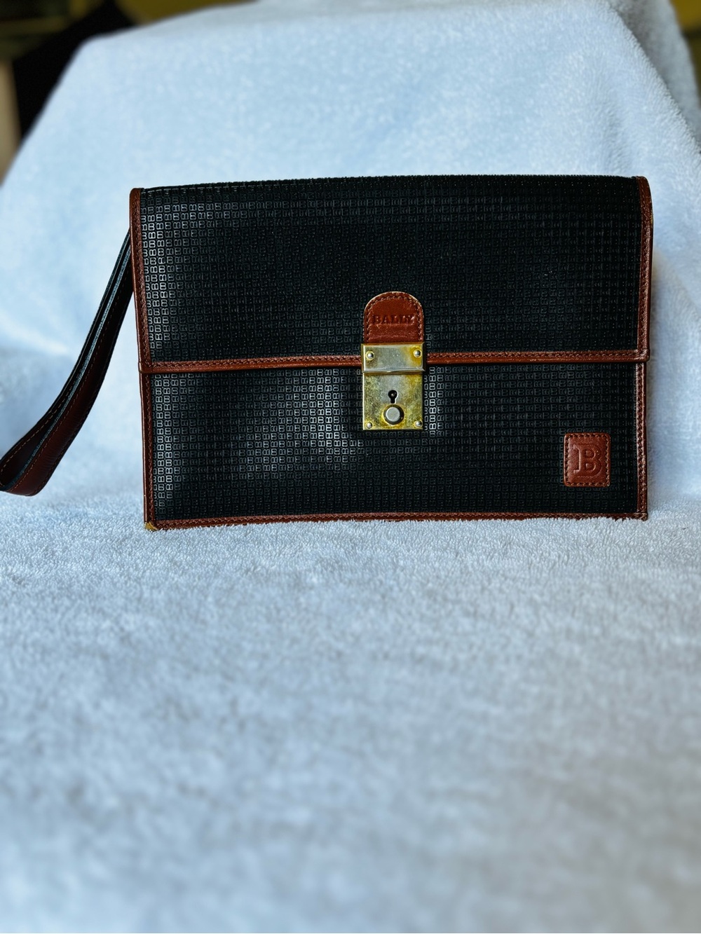 Bally Black Leather Wristlet with Brown Leather Trim and Brass Lock Accent